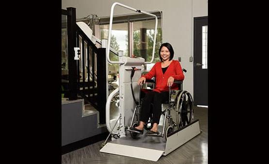 woman using wheelchair lift
