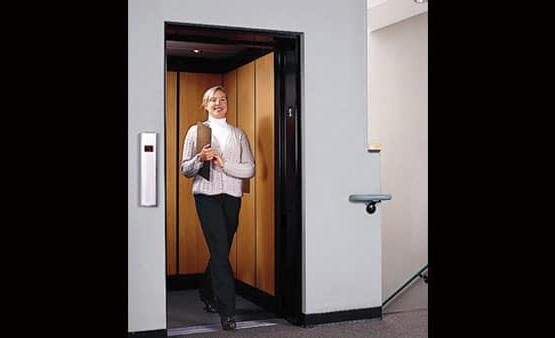 Woman using a Savaria Limited Use Limited Application Elevator